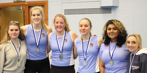 Students with medals at competition